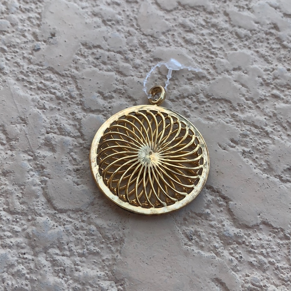 Gold tone pendant